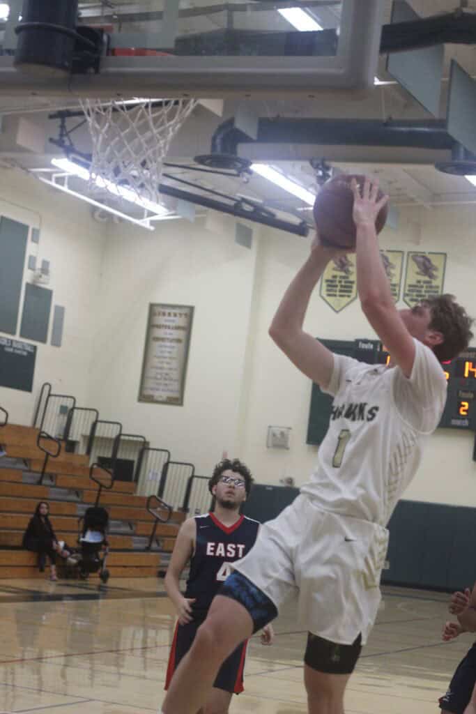 Hawks player prepares for a shot during a tournament game.