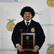 FFA finalist with award at Madera event.