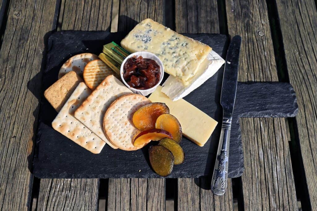 Cheese and chutney platter with assorted cheeses, crackers, and fruit preserves for holiday celebrat.