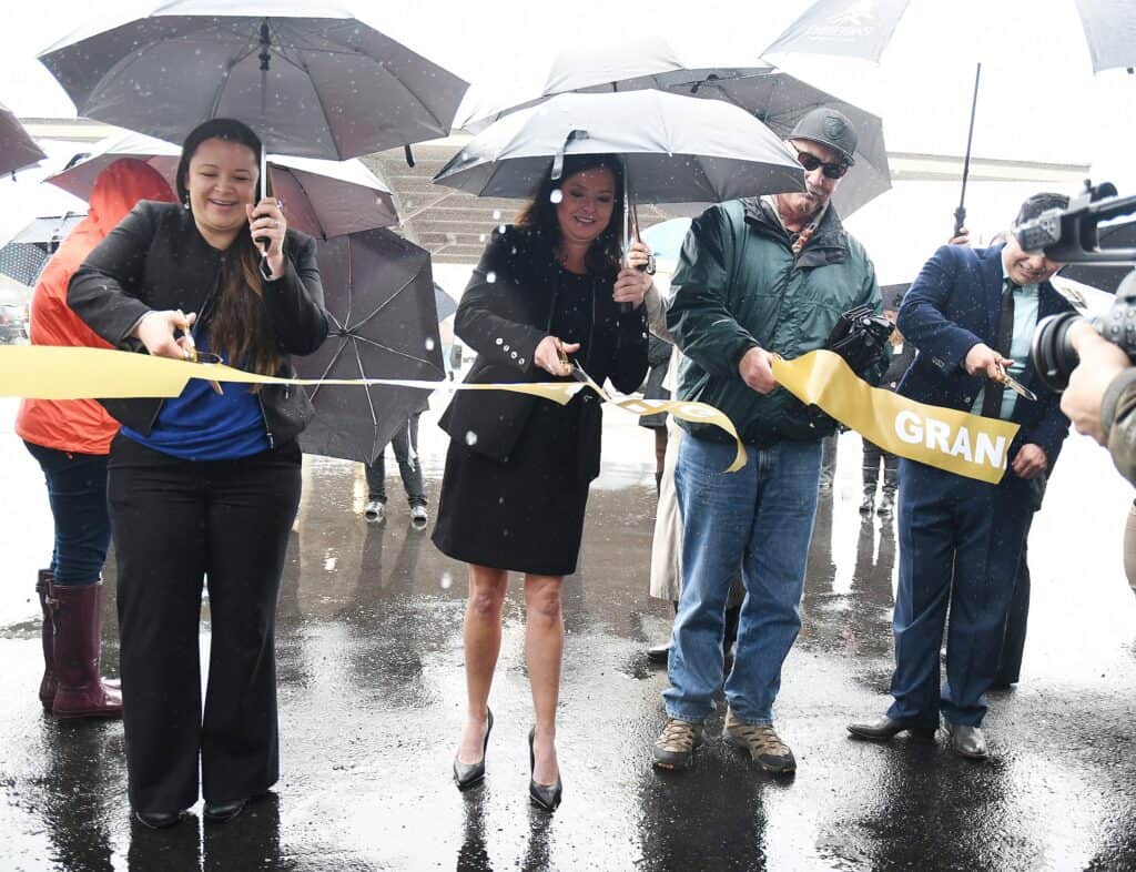 Ribbon cutting ceremony at Chukchansi's new fuel station in rain.