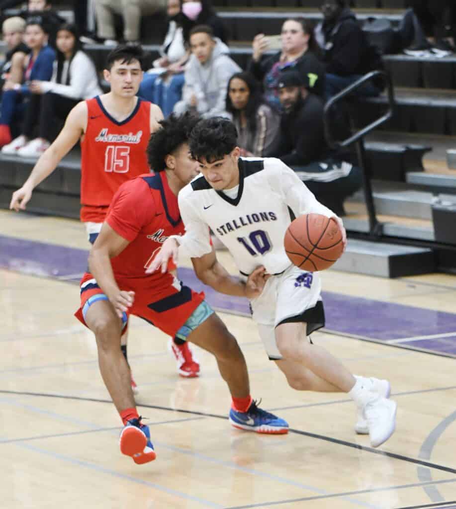 Madera Stallions player drives to the basket against short-handed opponents.