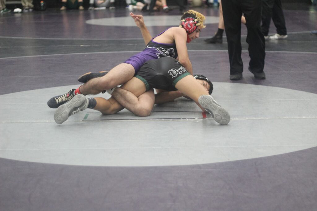 Madera wrestling match at Chukchansi with athletes competing on the mat.