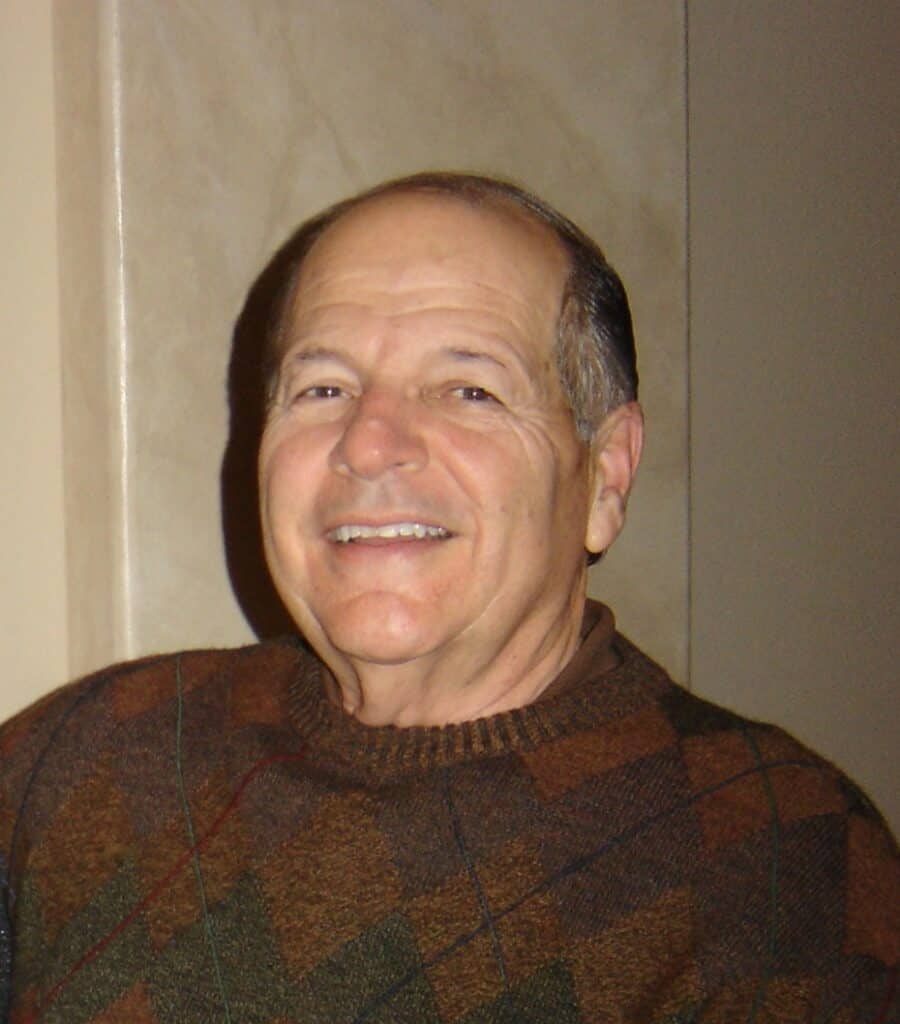 Monte Pistoresi smiling at a memorial event.