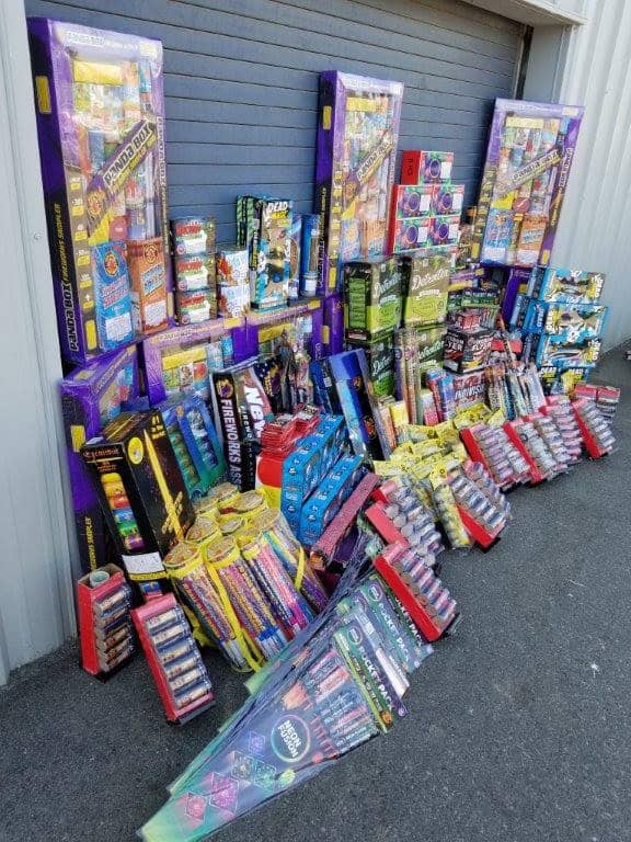 Confiscated fireworks display outside a warehouse, seized during a campaign against illegal firework.