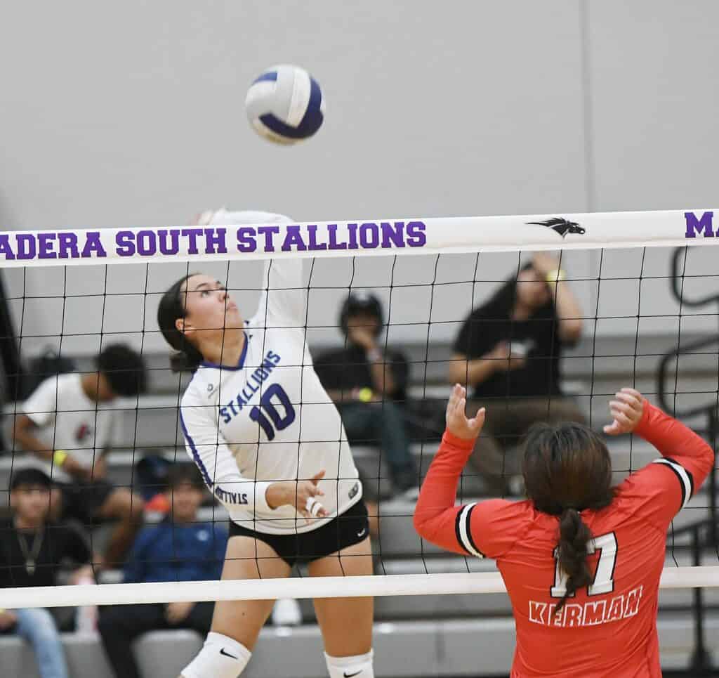 Madera South Stallions volleyball player spiking the ball during a game.