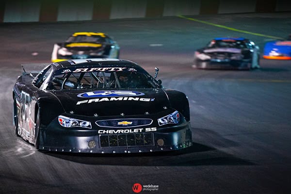 Race car leading at Madera Speedway.