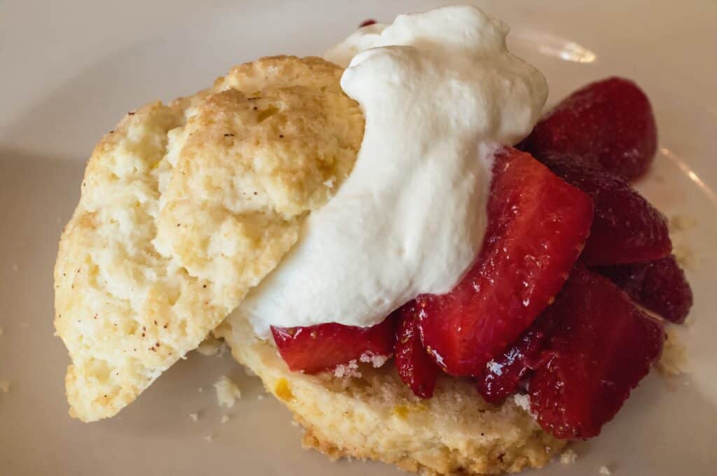 Delicious strawberry shortcake with whipped cream, perfect for a sweet treat.