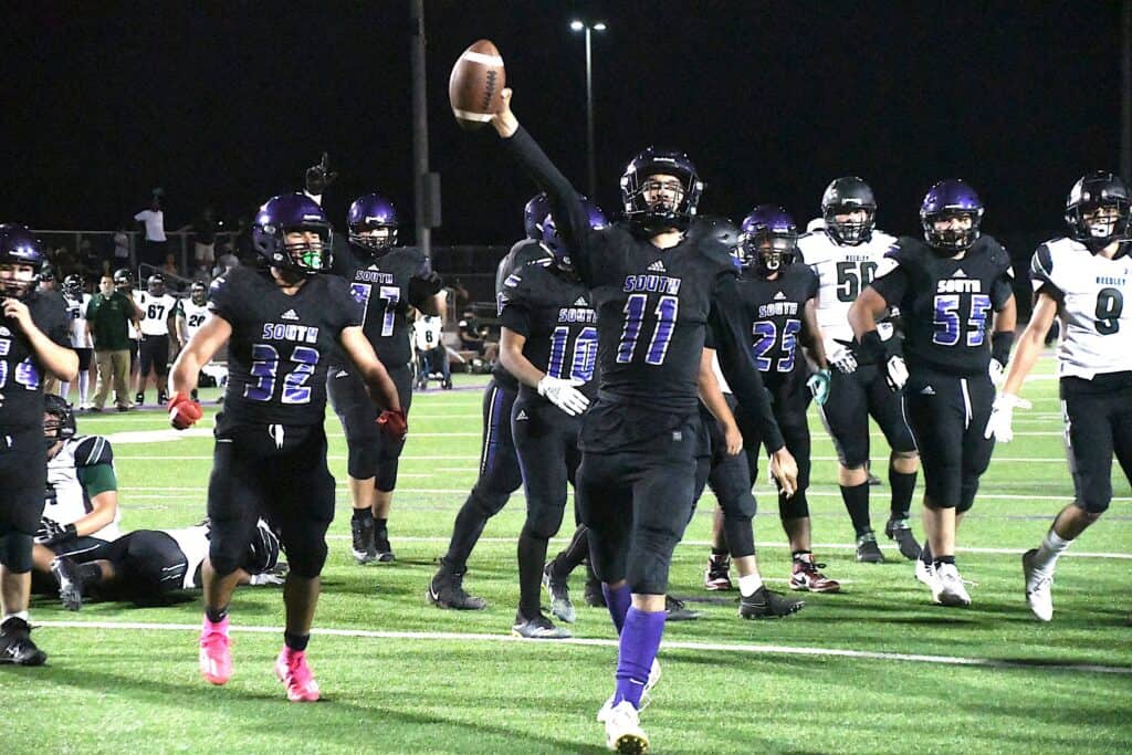 Madera Stallions football team celebrating on the field after winning their final game.