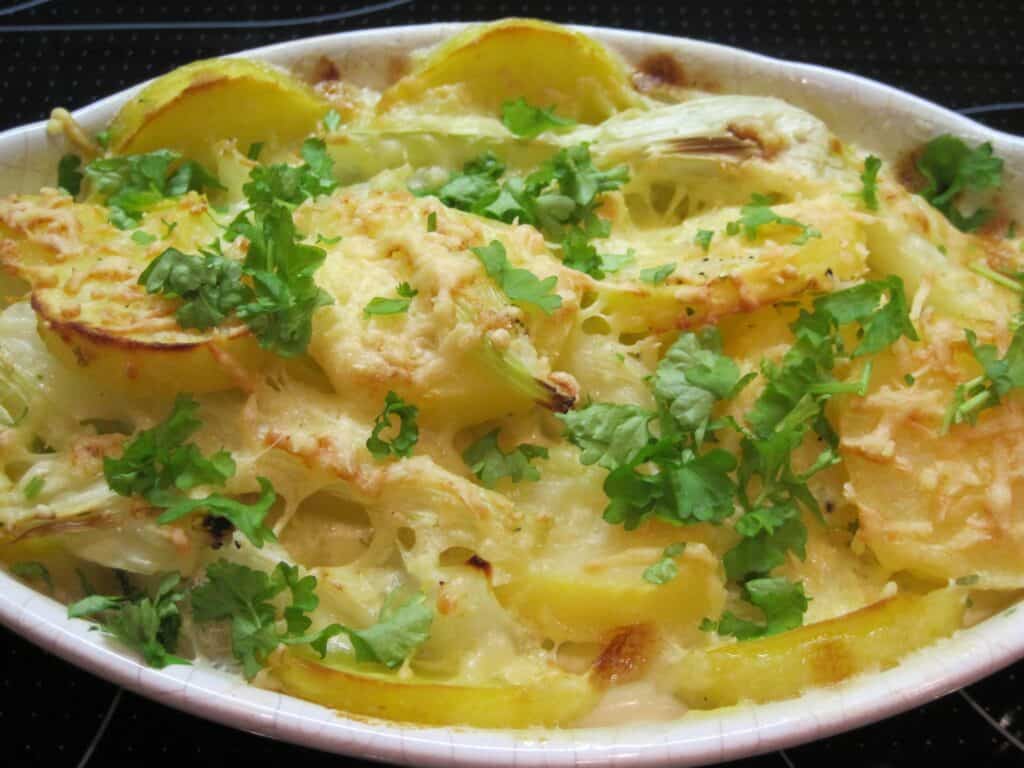 Tasty baked potato casserole with cheese and herbs.
