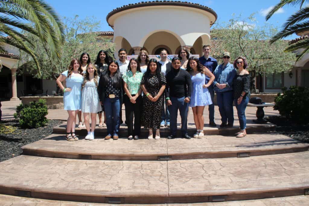 Madera County seniors recognized at the Farm Bureau event in a scenic outdoor setting.