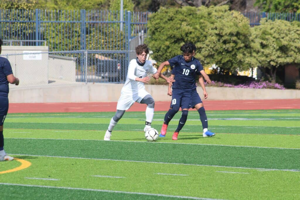 Madera Stallions soccer players competing on the field during a match.