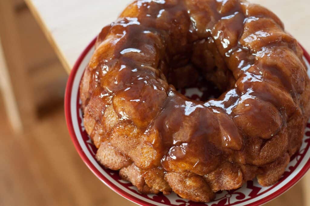 Delicious pull-apart cinnamon roll bread with caramel glaze, perfect for sharing.