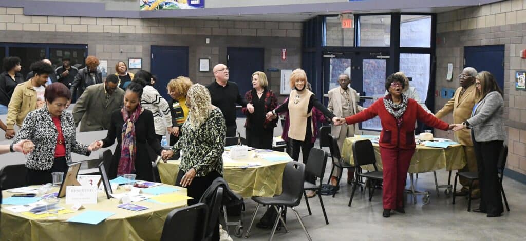 Celebrants at MLK event hold hands in unity during the ‘I, Too, Have a Dream’ celebration.