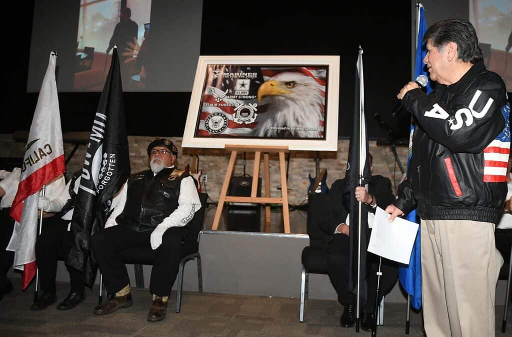 Community flag dedication event honoring Perez room at The Madera Tribune.