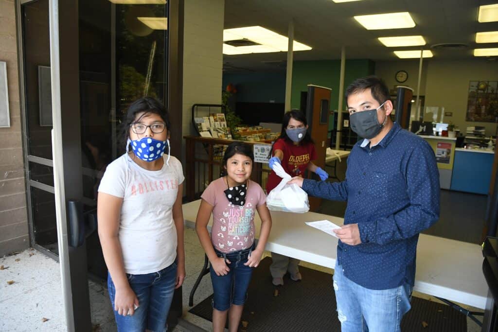 Children receiving rewards for summer reading challenge at the library.