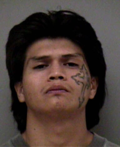 Suspect mugshot related to home invasion robbery, featured in The Madera Tribune.