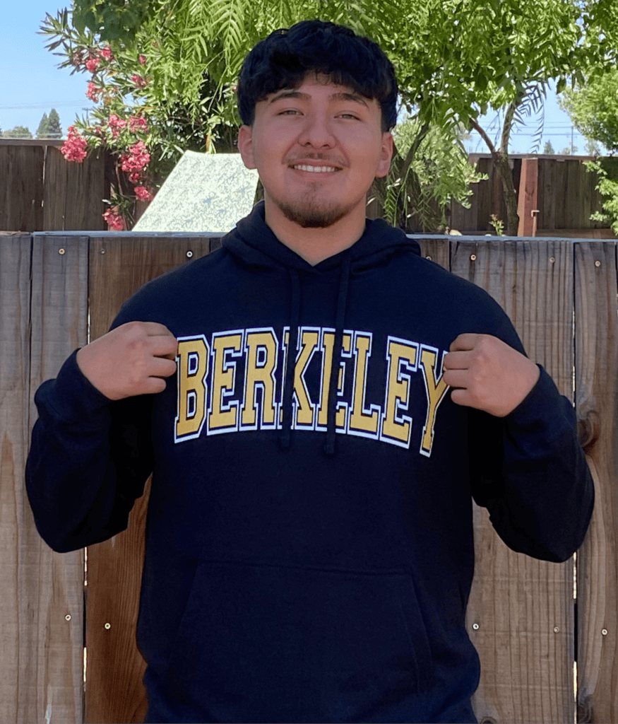 Student in Berkley hoodie awarded Gates Scholarship for academic excellence.