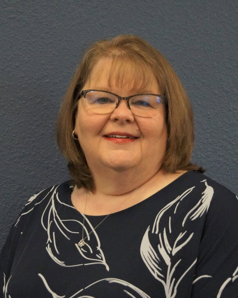 Retired assistant superintendent recognized for dedicated service in education.
