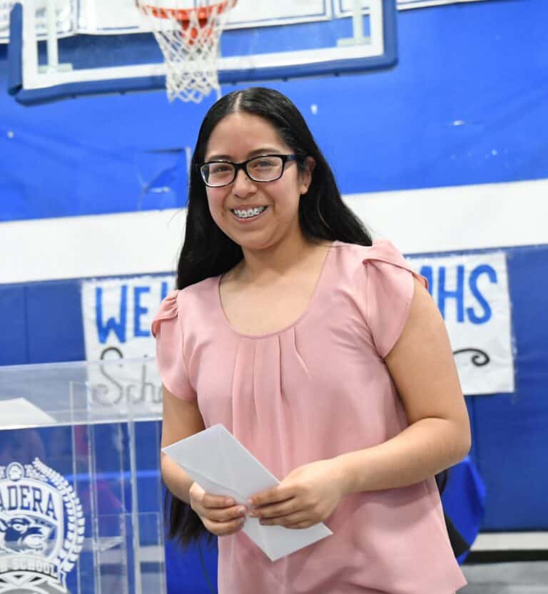 Determination leads to graduation for farm worker-head of her family