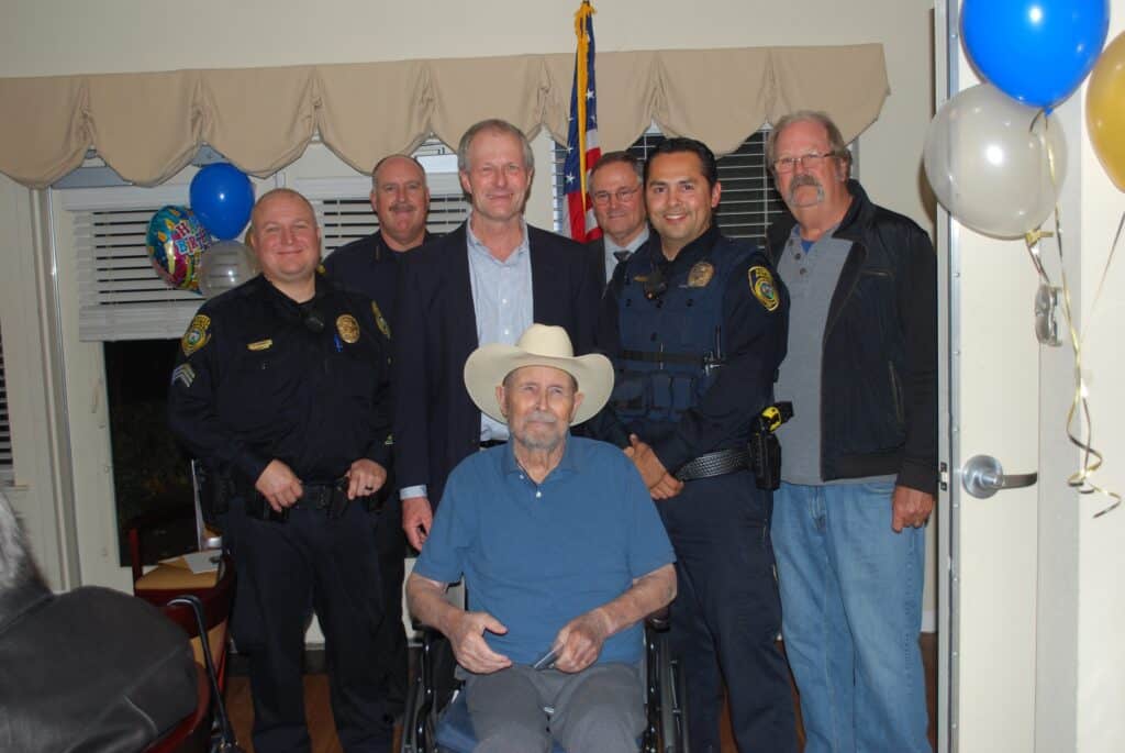 Group of police officers and community leaders at a local event in Madera.