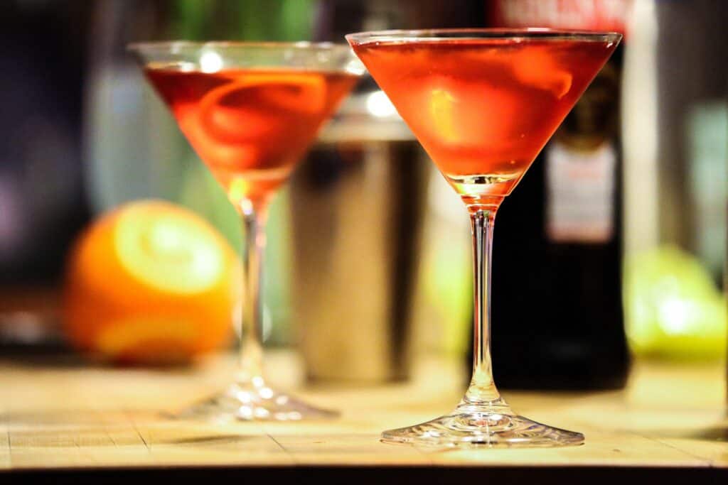 Two elegant cocktails with orange slices for New Year celebration.