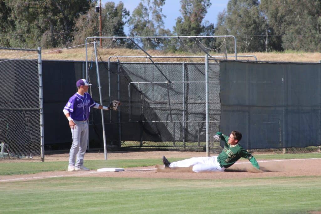 Madera Panthers player sliding into home plate during game.