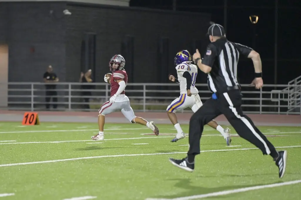 Photo - Torres’ Jordan Garcia checks out where the defender is during his 78-yard touchdown reception in Friday’s win over Fresno. Garcia caught three passes for 128 yards in the game. 